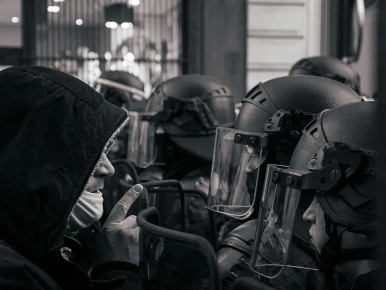 Grayscale photo of a motorcycle helmet